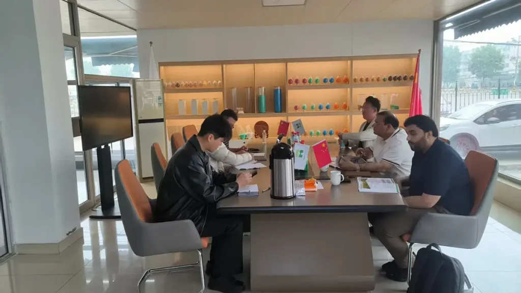 Pakistani customers meeting with the Risso Fertilizer team in the conference room to discuss fertilizer products and potential business cooperation.